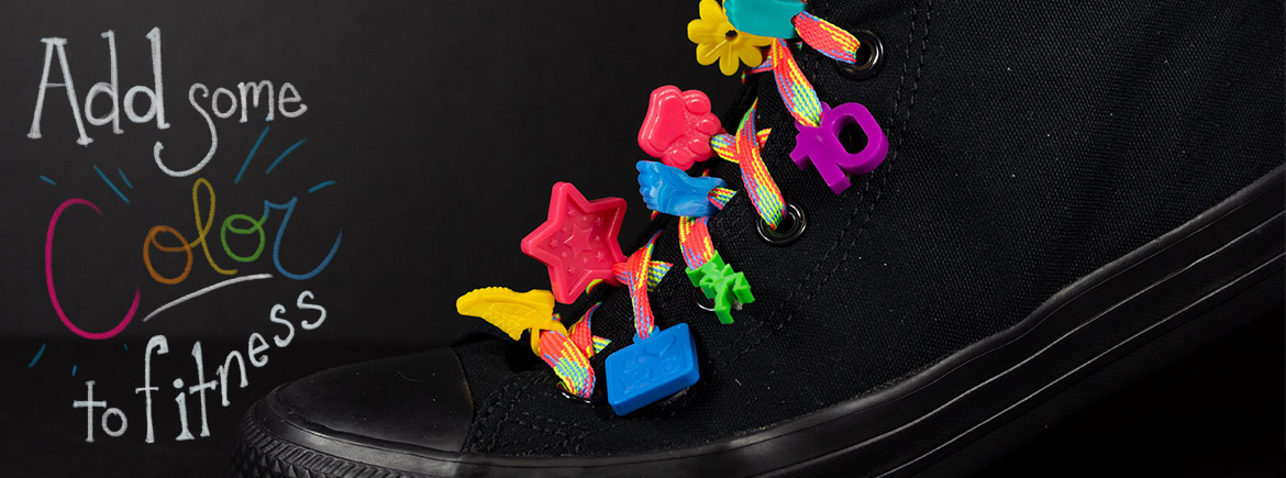 black Shoe with charms displayed on the shoelaces